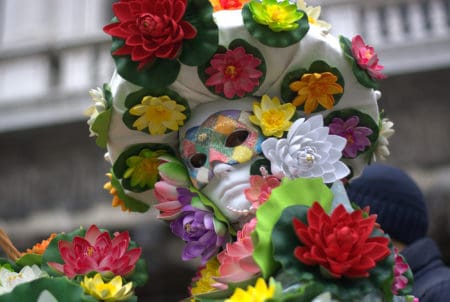 White Mardi Gras costume and mask with colorful flowers