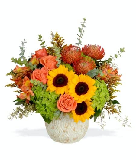 Send them the yellow-y orange hues of a field of pumpkins with our fall arrangement, "Pumpkin Patch!" Features orange roses, big, bright sunflowers, and orange alstroemeria artfully arranged in an Andaz pot from Accent Decor.
